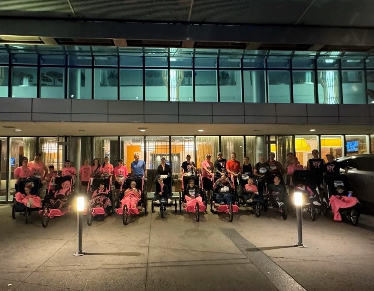 Group photo of Ainsley's Angels volunteers and participants. 